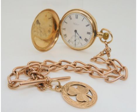 A 9CT GOLD WALTHAM FULL HUNTER with white enamelled dial with black roman numerals, subsidiary seconds dial and blued steel h
