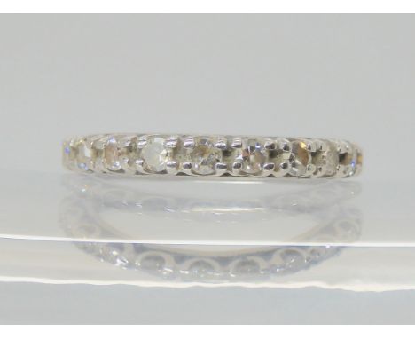 A DIAMOND SET FULL ETERNITY RING the white metal mount is set with estimated approx 0.80cts, finger size M, weight 3.6gms Con