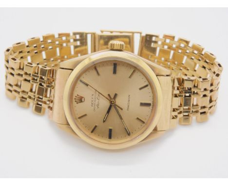 A 9CT GOLD ROLEX OYSTER PERPETUAL AIR KING PRECISION with gold coloured dial, baton numerals and hands. With Rolex box link b