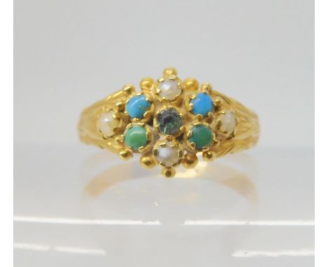 AN 18CT GOLD VINTAGE RING set with turquoise, pearls and a clear gem, the shank engraved with leaves. Finger size O1/2, weigh