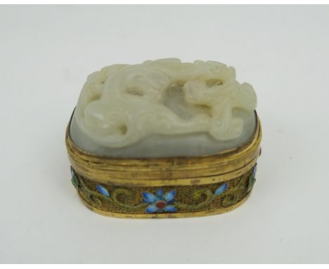 A CHINESE HARDSTONE, SILVER GILT AND ENAMEL BOX&nbsp; The cover carved as a chilong,the gilt metal sides decortaed with ename