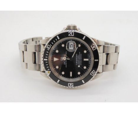 A ROLEX OYSTER PERPETUAL DATE, SUBMARINER with black dial, luminous baton, dot and chevron numerals and hands, with date aper