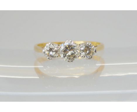 A THREE STONE DIAMOND RING mounted throughout in 18ct gold, and set with estimated approx 0.91cts in total of brilliant cut d