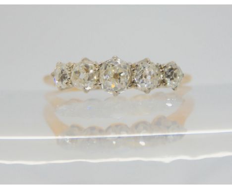 A FIVE STONE DIAMOND RING set with estimated approx 0.60cts of old cut diamonds. Finger size O1/2, weight 2.4gms Condition Re