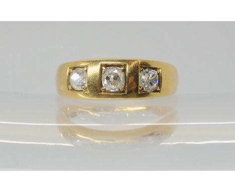 A VICTORIAN THREE STONE DIAMOND RING the 18ct gold shank, hallmarked 1860 Birmingham, set with three old cut diamonds to a co