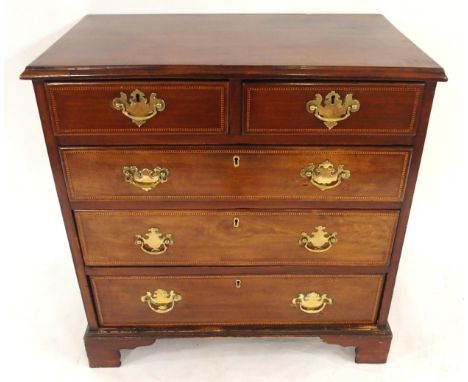 A GEORGIAN MAHOGANY TWO OVER THREE CHEST OF DRAWERS with checker line inlays and brass drawer pulls on bracket feet, 80cm hig