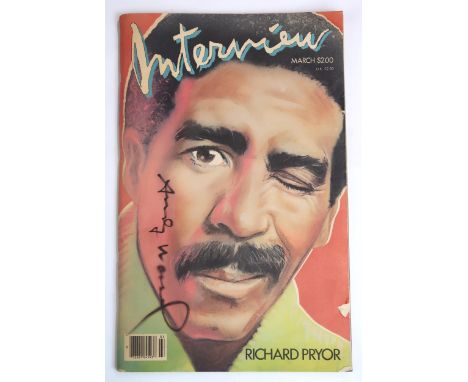 A COPY OF INTERVIEW MAGAZINE, SIGNED BY ANDY WARHOL March 1986, with cover star Richard Pryor, front cover signed vertically 