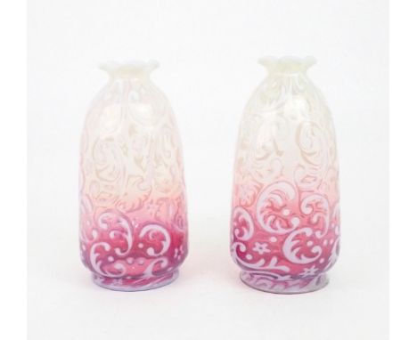 A PAIR OF CRANBERRY AND VASELINE GLASS LIGHT SHADES possibly by John Walsh Walsh, each decorated with flowers and scrolling d