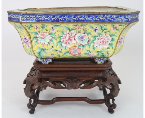 A CANTON ENAMEL YELLOW GROUND JARDINIERE&nbsp; Painted with peonies and scrolling foliage, beneath a blue ground band and on 