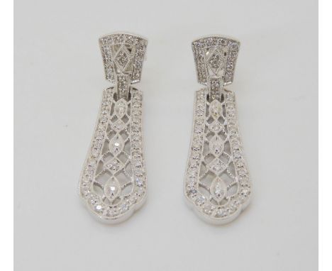 A PAIR OF DIAMOND DROP EARRINGS set with brilliant cut diamonds to the pierced and milgrain panels. Length 3.4cm x 0.9cm, wei