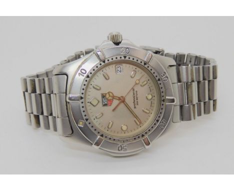 A TAG HEUER PROFESSIONAL with silvered dial, baton and dot luminous numerals and hands, with date aperture, diameter of the c