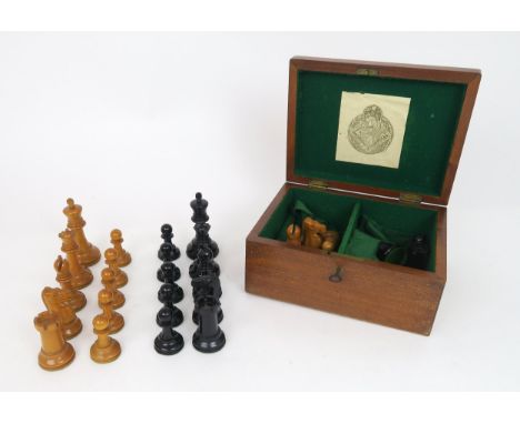 A JAQUES & SONS, LONDON STAUNTON PATTERN BOXWOOD AND EBONY CHESS SET In mahogany box, lined in green baize; one knight and on