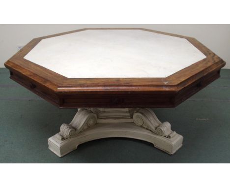 A VICTORIAN ARCHITECTURAL OCTAGONAL&nbsp; LIBRARY TABLE with white painted top surrounded by shaped&nbsp; frieze over painted