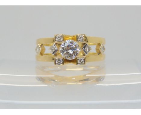 A RETRO 18CT GOLD SOLITAIRE DIAMOND RING set with an estimated approx 0.60ct brilliant cut diamond, four princess cut diamond