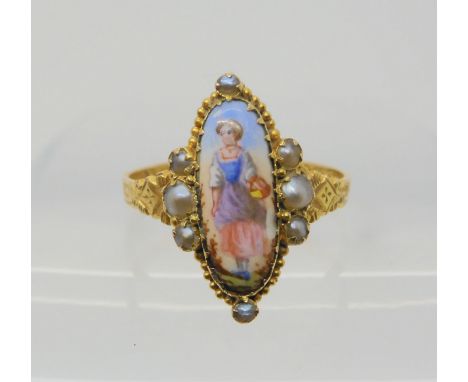 A VICTORIAN ENAMEL AND PEARL RING the central plaque depicting a maiden in a landscape, surrounded with split pearls, with en