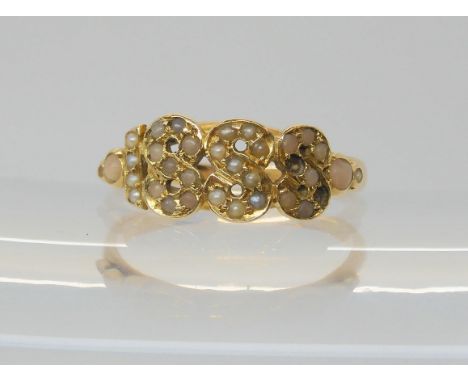 A VICTORIAN RING the date 1888 picked out in split pearls and corals to the yellow metal mount. Finger size M, weight 2gms Co