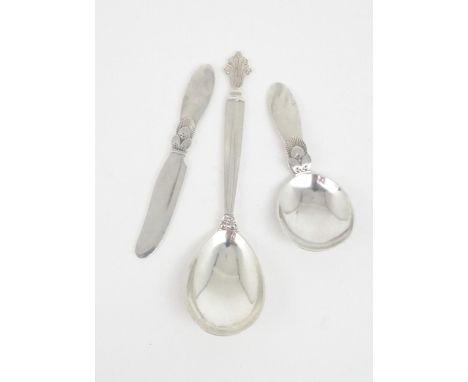 A GEORG JENSEN SILVER CADDY SPOON in the Cactus pattern,&nbsp; and an accompanying knife with import marks for London 1938, a