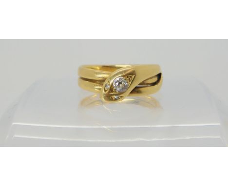 A DIAMOND SET SNAKE RING the shank stamped 18, with inscription 'From Mother 1893' the head is set with an old cut diamond of