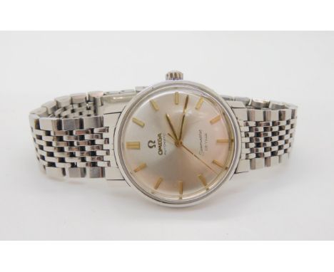 AN OMEGA AUTOMATIC SEAMASTER DE VILLE in stainless steel. Silvered dial with gold baton numerals and hands. Diameter of the c