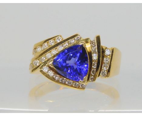 A LE VIAN TANZANITE AND DIAMOND RING the 18ct yellow gold dress ring set with a trilliant cut tanzanite of approx 8mm x 8mm x