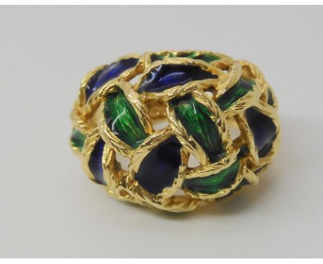 AN ENAMELLED KUTCHINSKY RING the woven pattern enamelled in blue and green, Full Kutchinsky signature, with London hallmarks 