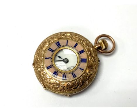 A 9ct gold button wind pocket watch with enamel face. 33mm case 26.9g. Winds and runs. Postage A