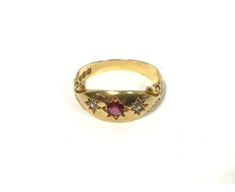 A ruby and diamond set 18ct gold ring. Size L1/2 and 3.56g Postage A