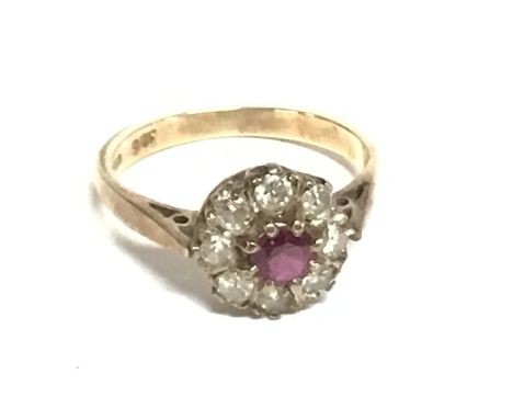 A 9ct gold ring set with ruby and diamonds. Size J and 2.37g. Postage B