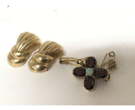 A pair of 9carat gold clip on earrings weight 4.3g and a 9carat gold brooch set with Opal and amethyst stones in the form of 