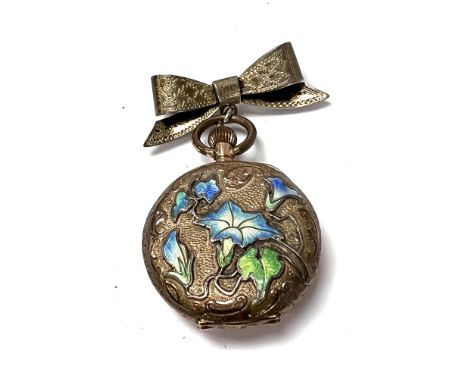 A small 14ct gold outer cased fob watch with enamel decoration to the reverse, with a sterling silver brooch mount. (B)