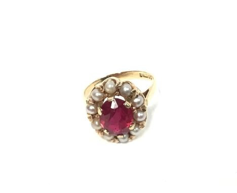 9ct gold ring with central ruby and pearls. Size L and 3.95g Postage B