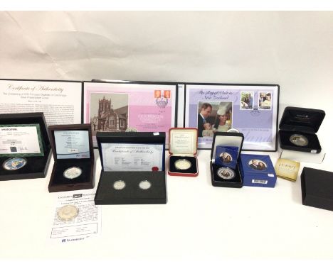 A collection of various silver coins including first day coin covers and 1oz silver proof hobbit coin with gold plating. Post