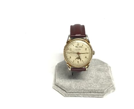 A vintage Eloga calendar with moon face watch. 34mm case. Not seen running. Postage B