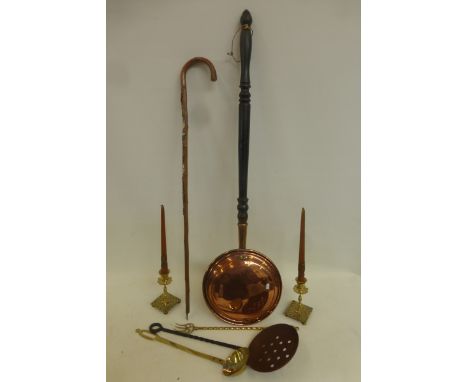 A copper warming pan, a ladle, a skillet, brass candlesticks, a toasting fork etc.