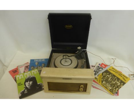 A Dansette Major De Luxe record player and an assortment of sheet music.