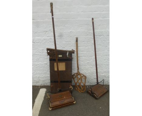 Two oak Ewbank carpet sweepers, a cane carpet beater and a trouser press.