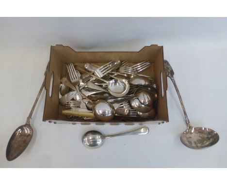 An assortment of silver plated flatware including a large silver plated ladle and serving spoon, including rat tail.