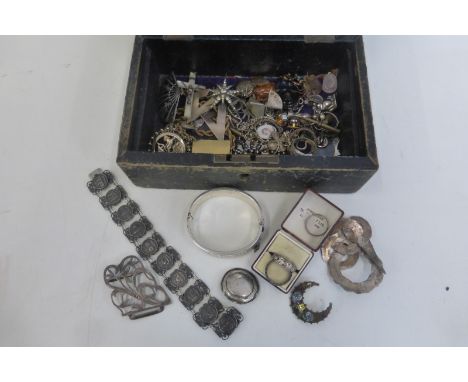 A box of silver jewellery including a bangle.