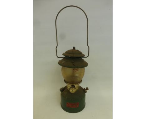 A Coleman paraffin storm lantern.