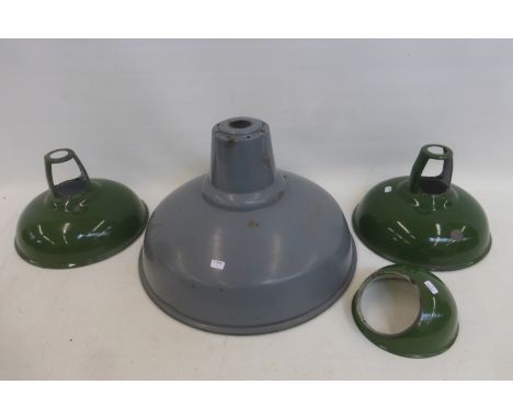 Four enameled light shades.
