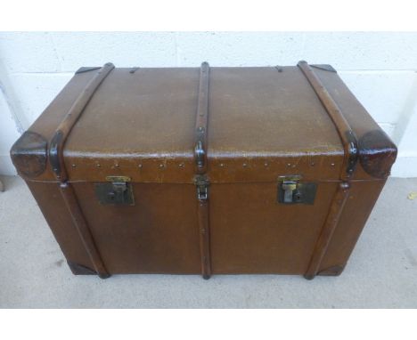 A Crescent canvas and wood bound travel trunk with lift out tray.