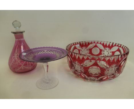 A ruby etched bohemian glass fruit bowl, a decanter and an amethyst glass tazza.