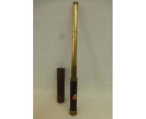 A Dolland of London three draw brass telescope with original leather fitted case.