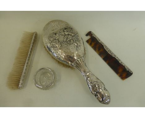 A silver backed hair brush, comb and clothes brush; also a silver rimmed salt.