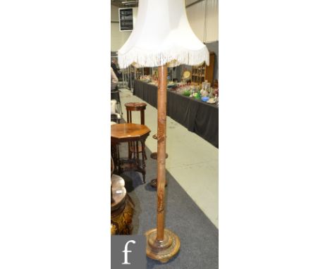A 1930s Chinese carved bamboo standard lamp, detailed with sailing boats above a stepped circular base, together with a later