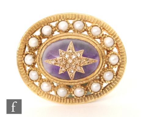 A modern hallmarked oval brooch with diamond encrusted star set of a cabochon amethyst all within a split pearl set border, l
