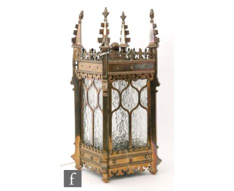 A 20th Century brass hall lantern with a glass panel to each side in the gothic style, height 56cm