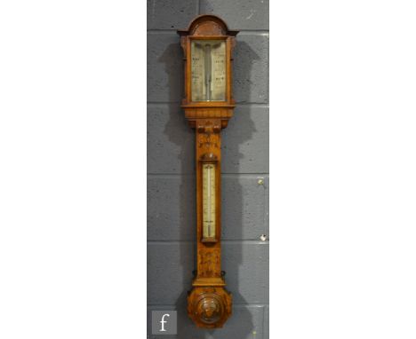 A mid 19th century oak stick barometer by Bailey Birmingham signed on scale with a thermometer attachment below a carved pedi