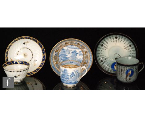 A 19th Century Worcester teabowl and saucer with wrythen moulding and a blue border edge with gilt laurel leaves and sprigs o