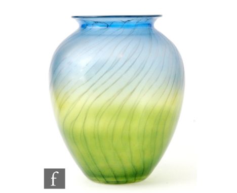 A 20th Century glass vase of ovoid form with collar neck in a graduated blue to green iridescence with sweeping trails, heigh